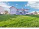Expansive backyard with a well-maintained lawn, mature trees and an inviting outdoor deck at 12880 Oxbridge Pl, Fishers, IN 46037
