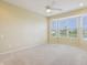 Sunny bedroom with a large bay window offering beautiful views of the neighborhood at 12880 Oxbridge Pl, Fishers, IN 46037