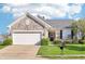 Charming single-Gathering home with stone facade, attached two-car garage, and well-manicured lawn at 12880 Oxbridge Pl, Fishers, IN 46037
