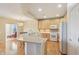 Well-lit kitchen features natural wood cabinets, modern appliances, and ample countertop space at 12880 Oxbridge Pl, Fishers, IN 46037