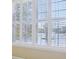 Close-up of white window shutters, allowing ample light while providing privacy at 12880 Oxbridge Pl, Fishers, IN 46037