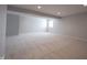 Spacious carpeted basement with recessed lighting and a window allowing for ample natural light at 12964 Walbeck Dr, Fishers, IN 46037