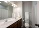 Bathroom with double sink vanity, large mirror, tile flooring, and a shower with white shower curtain at 12964 Walbeck Dr, Fishers, IN 46037