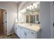 Bathroom featuring double sinks, a large mirror, and a separate tiled shower at 12964 Walbeck Dr, Fishers, IN 46037