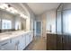Bright bathroom featuring double sinks, a separate shower, and tile flooring at 12964 Walbeck Dr, Fishers, IN 46037