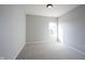 Bright bedroom with carpeted floor, neutral walls, and a window view at 12964 Walbeck Dr, Fishers, IN 46037