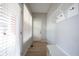 Inviting entryway with light wood floors, a white storage bench, and coat hooks, maximizing functionality at 12964 Walbeck Dr, Fishers, IN 46037