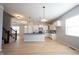 Modern kitchen boasts a large island with black countertops and stainless steel appliances at 12964 Walbeck Dr, Fishers, IN 46037