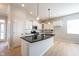 Stylish kitchen features white cabinets, dark counters, and a center island at 12964 Walbeck Dr, Fishers, IN 46037