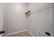 A simple laundry room with tile flooring, a wire shelf, and hookups, offering a functional space at 12964 Walbeck Dr, Fishers, IN 46037