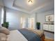 Spacious bedroom features a tray ceiling and access to an en-suite bathroom at 12964 Walbeck Dr, Fishers, IN 46037