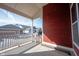Covered porch area with red siding and white railing at 12964 Walbeck Dr, Fishers, IN 46037