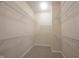 Walk-in closet featuring built-in shelving and neutral carpeting at 12964 Walbeck Dr, Fishers, IN 46037