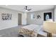 Spacious bedroom with carpet, ceiling fan, and ensuite bathroom at 1818 Arlene Dr, Indianapolis, IN 46219