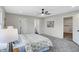 Spacious bedroom with carpet, ceiling fan, and ensuite bathroom at 1818 Arlene Dr, Indianapolis, IN 46219