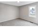 Empty bedroom with neutral gray carpet, one window, and plenty of light at 1818 Arlene Dr, Indianapolis, IN 46219