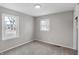 Bedroom with neutral walls, carpeting, and two windows at 1818 Arlene Dr, Indianapolis, IN 46219