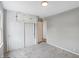 Cozy bedroom featuring built-in cabinets and closet with white sliding doors at 1818 Arlene Dr, Indianapolis, IN 46219