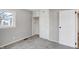 Bedroom with built in storage and neutral colored carpet and walls at 1818 Arlene Dr, Indianapolis, IN 46219