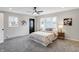 Cozy bedroom featuring plush gray carpet, and lots of natural light at 1818 Arlene Dr, Indianapolis, IN 46219