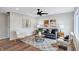 Inviting living room featuring modern furniture, stylish decor, hardwood floors, and recessed lighting at 1818 Arlene Dr, Indianapolis, IN 46219