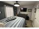 Bedroom with a Millennium Falcon model, neutral gray walls, and a window at 1905 Apple St, Greenfield, IN 46140