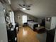 Bedroom featuring hardwood floor, black furniture set, ceiling fan and unique decorations at 1905 Apple St, Greenfield, IN 46140