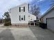Exterior view of the back of the house, showcasing the deck and well-maintained gravel yard at 1905 Apple St, Greenfield, IN 46140
