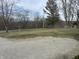 View of the gravel driveway and road bordering the property at 1905 Apple St, Greenfield, IN 46140