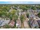 A neighborhood with a mix of established homes, mature trees, and new construction underway at 206 N Hamilton Ave, Indianapolis, IN 46201