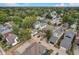 A residential area with diverse houses, mature trees, and some new construction in progress at 206 N Hamilton Ave, Indianapolis, IN 46201