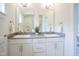 Bathroom featuring double vanity with undermount sinks and white cabinets at 206 N Hamilton Ave, Indianapolis, IN 46201