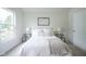 Bright bedroom with plush carpeting, neutral decor, and two bedside tables at 206 N Hamilton Ave, Indianapolis, IN 46201