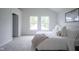 Bright bedroom with plush carpeting, neutral decor, and an open door at 206 N Hamilton Ave, Indianapolis, IN 46201