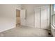 Comfortable bedroom with neutral walls, two closets, and a window at 206 N Hamilton Ave, Indianapolis, IN 46201