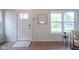 Bright entryway featuring wood floors, natural light, and a stylish front door at 206 N Hamilton Ave, Indianapolis, IN 46201
