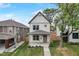 Home's facade with a covered front porch, well-maintained landscaping, and a clean, modern look at 206 N Hamilton Ave, Indianapolis, IN 46201