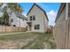 Charming two-story home with a manicured front yard, a sidewalk, and light-colored siding at 206 N Hamilton Ave, Indianapolis, IN 46201