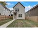 Charming two-story home with a manicured front yard, a sidewalk, and light-colored siding at 206 N Hamilton Ave, Indianapolis, IN 46201