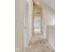 Bright hallway with a view into a bedroom and carpeted floors at 206 N Hamilton Ave, Indianapolis, IN 46201
