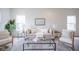 Bright living room featuring a comfortable seating arrangement and plenty of natural light at 206 N Hamilton Ave, Indianapolis, IN 46201