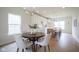 Bright eat-in kitchen features white cabinets, stainless appliances, and a central island with bar seating at 206 N Hamilton Ave, Indianapolis, IN 46201