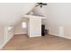 Finished attic space features wood floors, neutral walls, and a ceiling fan at 2110 N Talbott St, Indianapolis, IN 46202