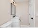 Modern bathroom featuring a sleek vanity with black hardware and a minimalist black-framed mirror at 2110 N Talbott St, Indianapolis, IN 46202