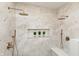 Modern bathroom showcasing marble-style tile, dual shower heads, and a convenient built-in shower seat at 2110 N Talbott St, Indianapolis, IN 46202