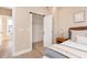Bedroom showcases neutral tones, wood floors, and a closet with a sliding door at 2110 N Talbott St, Indianapolis, IN 46202