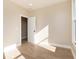 Sun-drenched bedroom with hardwood floors and a view to the outside at 2110 N Talbott St, Indianapolis, IN 46202