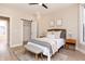 Bright bedroom features neutral tones, wood floors, and an open closet at 2110 N Talbott St, Indianapolis, IN 46202