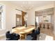 Open-concept design with a dining area featuring modern lighting and seamless flow to the kitchen at 2110 N Talbott St, Indianapolis, IN 46202