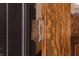 Detailed view of the decorative door hinge on the beautiful paneled door at 2110 N Talbott St, Indianapolis, IN 46202